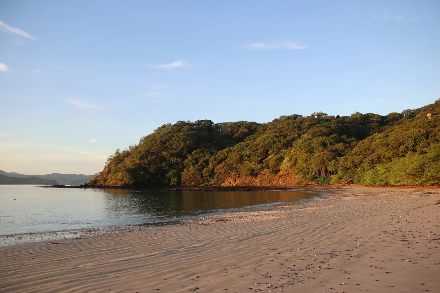 Golden-hour beach cove and volcanic headlands in the Gulf of Papagayo, Guanacaste