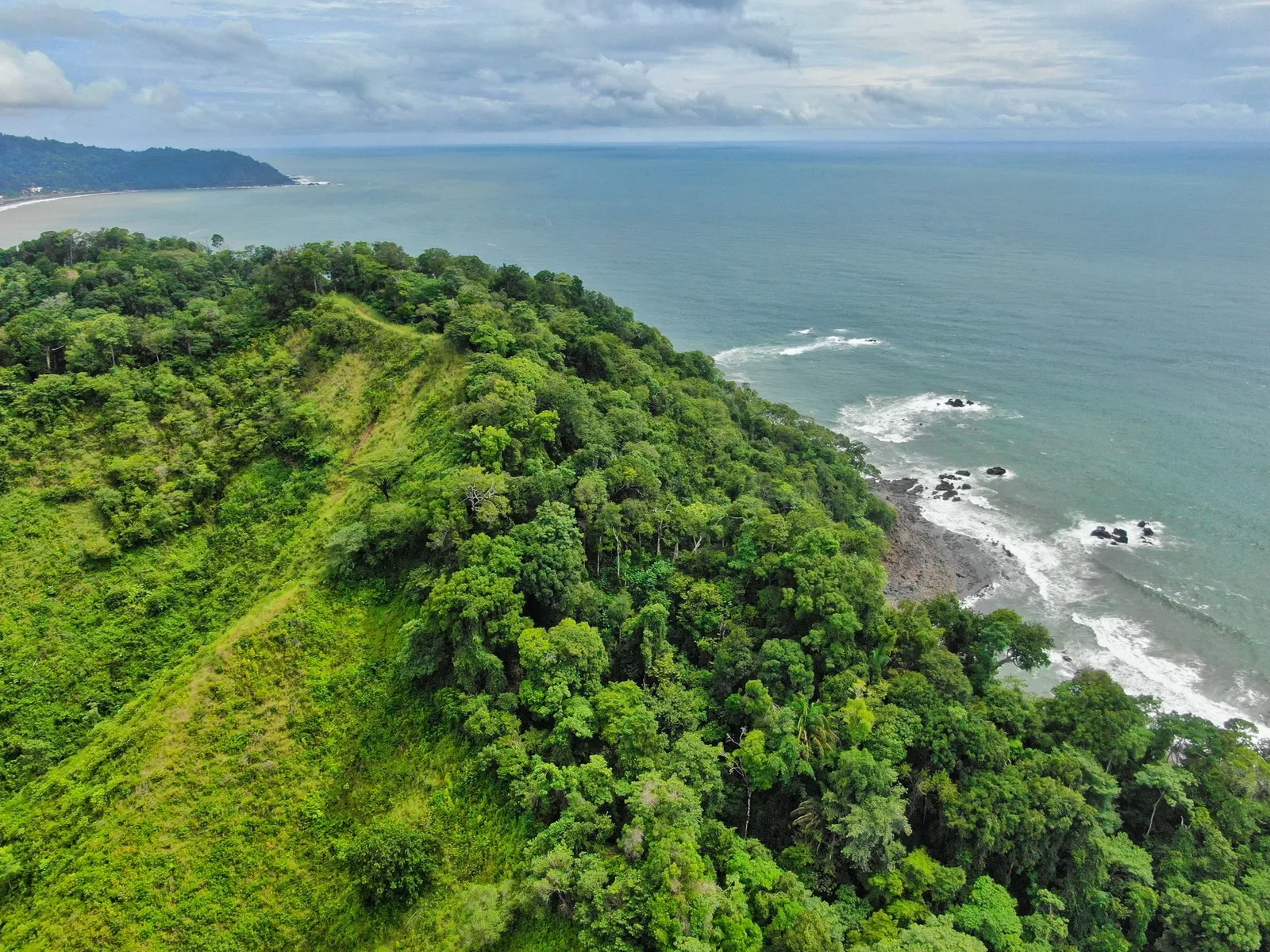 Rainforest mountains meeting the Central Pacific coastline at Jacó and Herradura